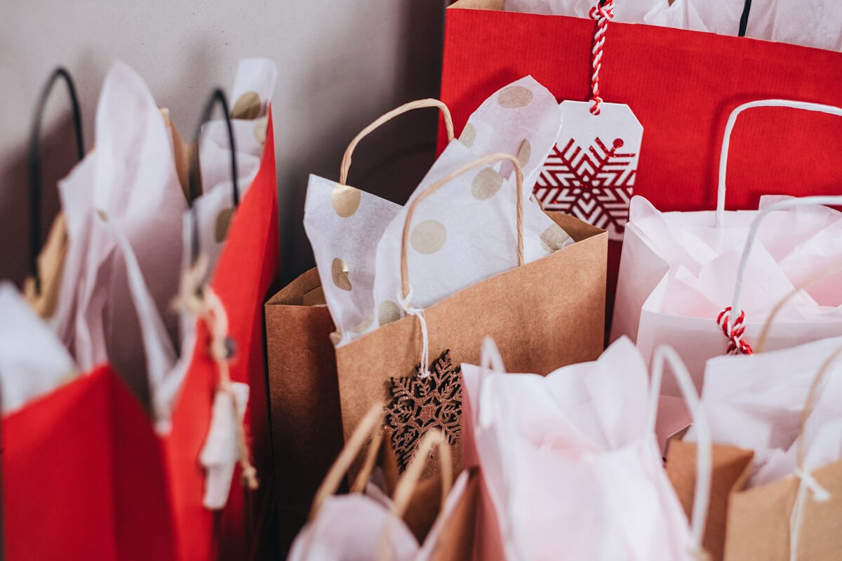 A photo of holiday-themed shopping bags